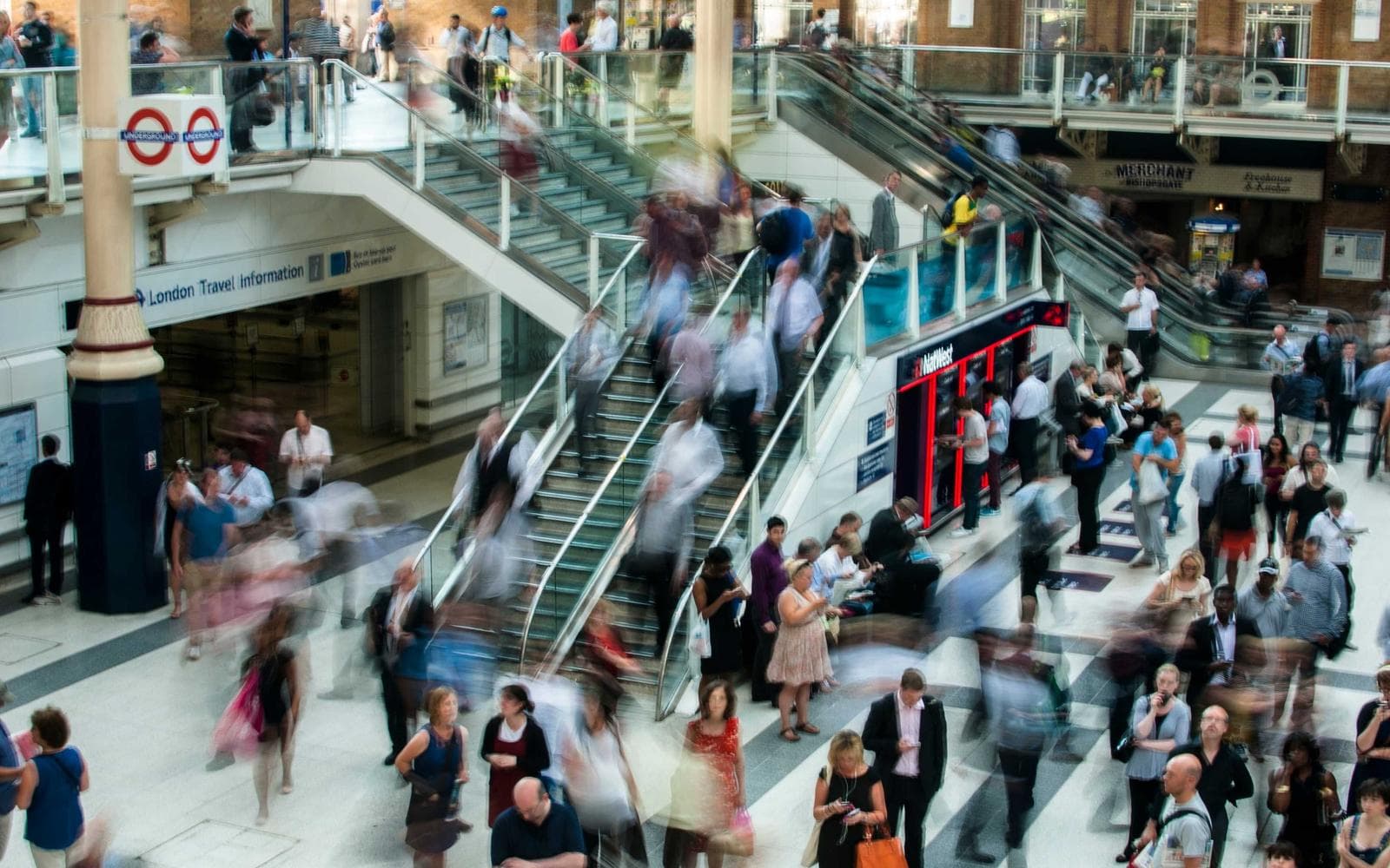 Commuters crowding the stairs of a busy station
